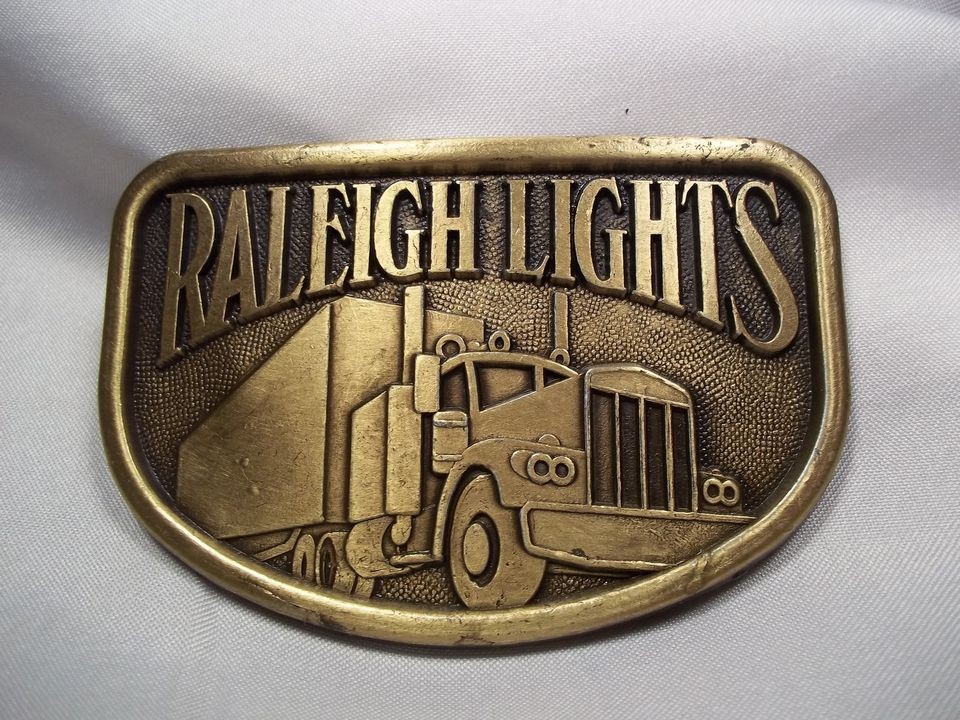   ADVERTISING RALEIGH LIGHTS KENWORTH TRUCK BELT BUCKLE COLLECTIBLE