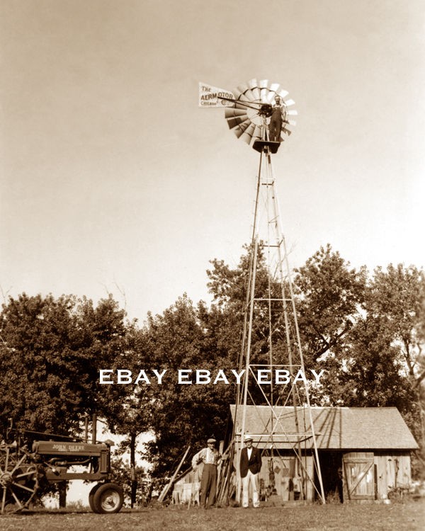   OF A FARMER ON TOP OF HIS AERMOTOR FARM WINDMILL & JOHN DEERE TRACTOR