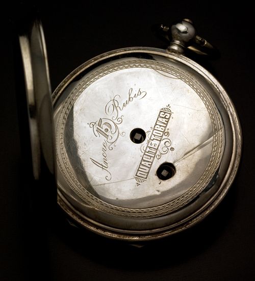 The watch was made in Switzerland. The silver case is marked with 