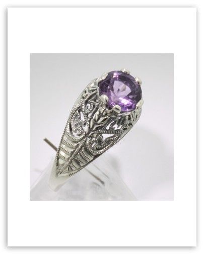  this beautiful filigree ring features a prong set 