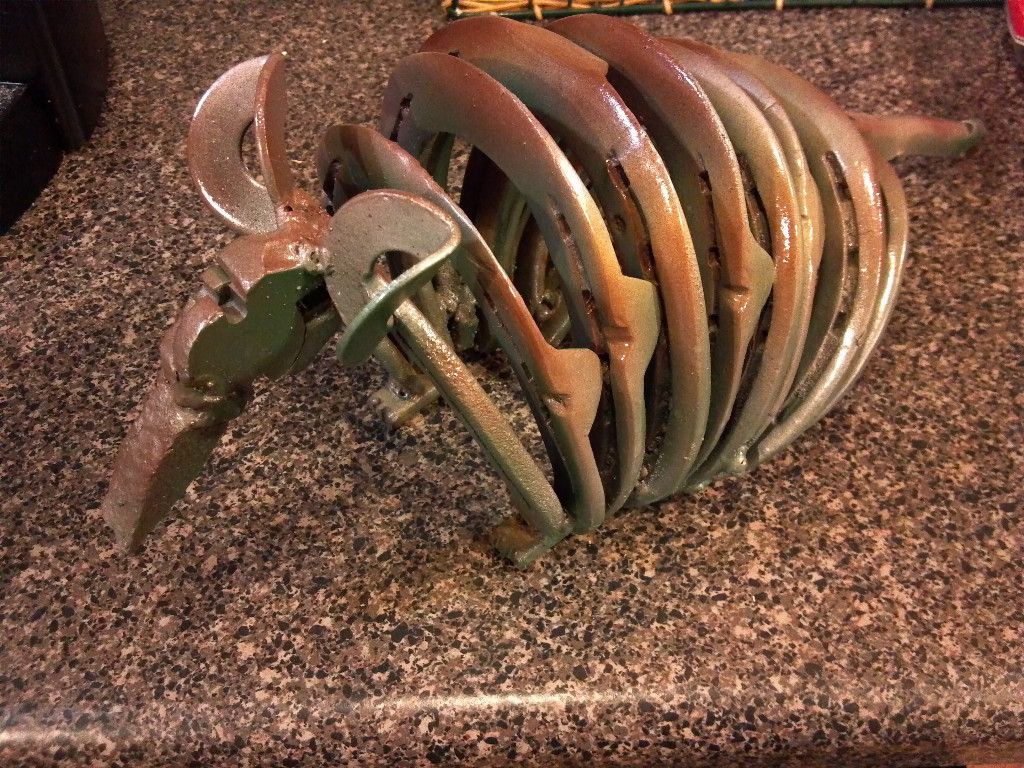 ARMADILLO made from scrap metal and horseshoes.