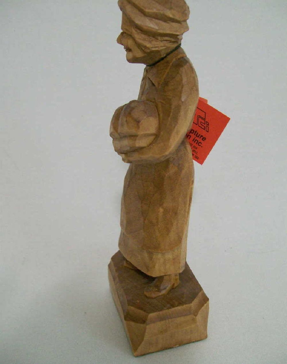 Old stock. Quebec carver signed Caron   Man carrying bundle.