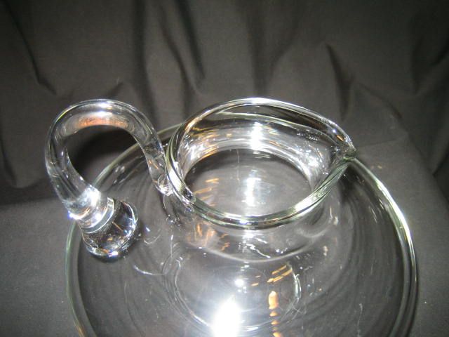  items they are both pitchers or decanters one is a large flat pitcher