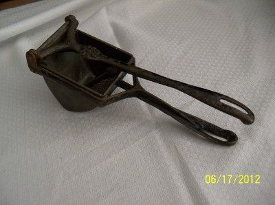 Antique Potato ricer Masher Silver Company Cast Iron 1902