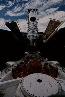 Joseph Tanner performing maintenance on the Hubble Space Telescope.