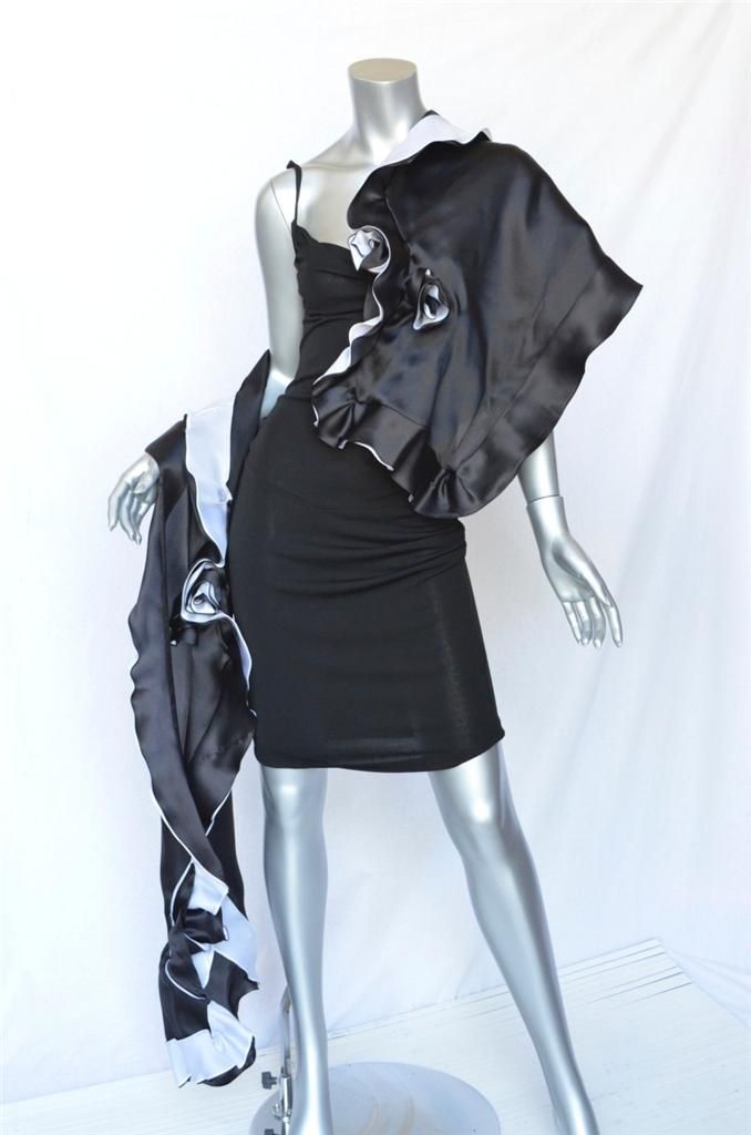 Dress up any outfit with this lovely Ilana Wolf wrap. A ruffled design