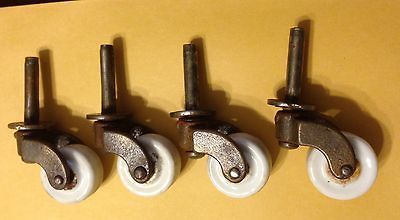 VINTAGE ANTIQUE SET OF 4 PORCELAIN STEM STYLE FURNITURE CASTERS WHEELS