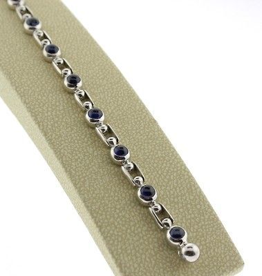 GENUINE SAURO 18 KARAT WHITE GOLD BRACELET.WITH BLUE SAPPHIRES.7.5